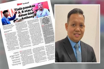 Laporan Sinar Harian pada Isnin. Mujibu (kanan).