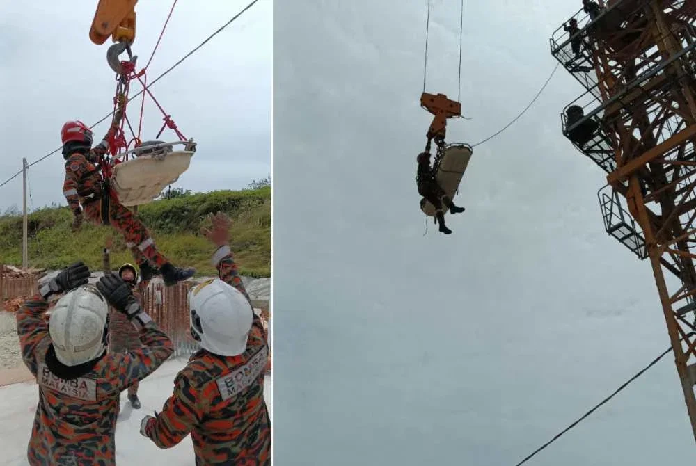 Anggota bomba menjalankan operasi menurunkan seorang operator menara kren yang tidak sedarkan diri pada ketinggian 45 meter di Residensi Puncak Austin, Johor Bahru. - Foto JBPM Johor