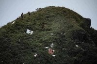 Serpihan bangkai pesawat itu ditemui di lereng Gunung Bulusaraung pada awal minggu lalu. - Foto: AFP