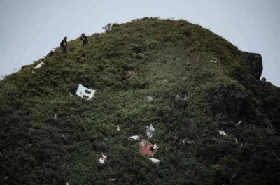 Serpihan bangkai pesawat itu ditemui di lereng Gunung Bulusaraung pada awal minggu lalu. - Foto: AFP