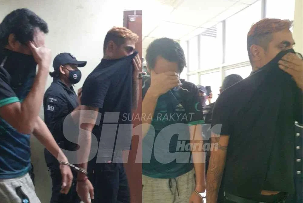 Kedua-dua tertuduh dikawal polis ketika dibawa ke Mahkamah Butterworth, pada Rabu.