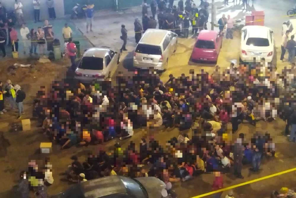 Antara warga asing yang ditahan dalam operasi di Taman Emas pada Khamis.