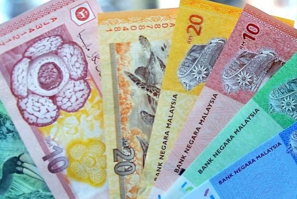 Ringgit ditutup tinggi berbanding dolar AS, mata wang utama lain serta unit serantau ASEAN pada Selasa. Foto: Bernama 