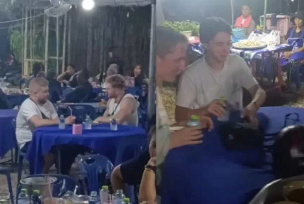 Beberapa pelancong sedang menikmati makanan yang disediakan dalam sebuah upacara pengebumian di Thailand. FOTO: Agensi