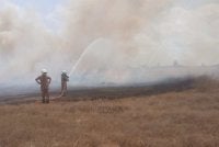 Bomba memadamkan kebakaran di lbelukar seluas 3.2 hektar di Kota Syahbandar, Melaka pada Khamis. FOTO: JBPM Melaka.