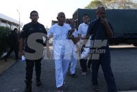 Yusof (dua dari kiri) dibawa ke Mahkamah Majistret Jitra pada Ahad.