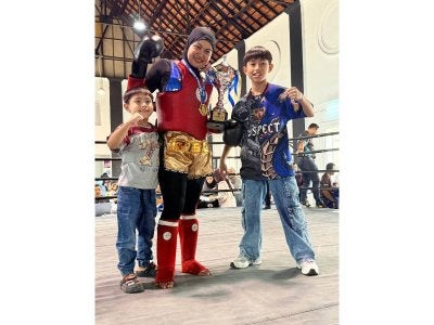 Adam Mikail, 12 (kanan) dan ibunya, Ima, 36 masing-masing memenangi pingat emas dalam kategori yang ditandingi mereka di Kejohanan Muaythai Sang Saka Biru pada 7 dan 8 Februari lalu.