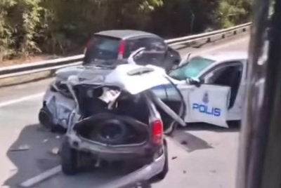 Tangkap layar rakaman video tular memaparkan insiden membabitkan sebuah kereta dan kenderaan polis di Jalan Ipoh-Lumut berhampiran Puncak Jelapang pada Selasa.