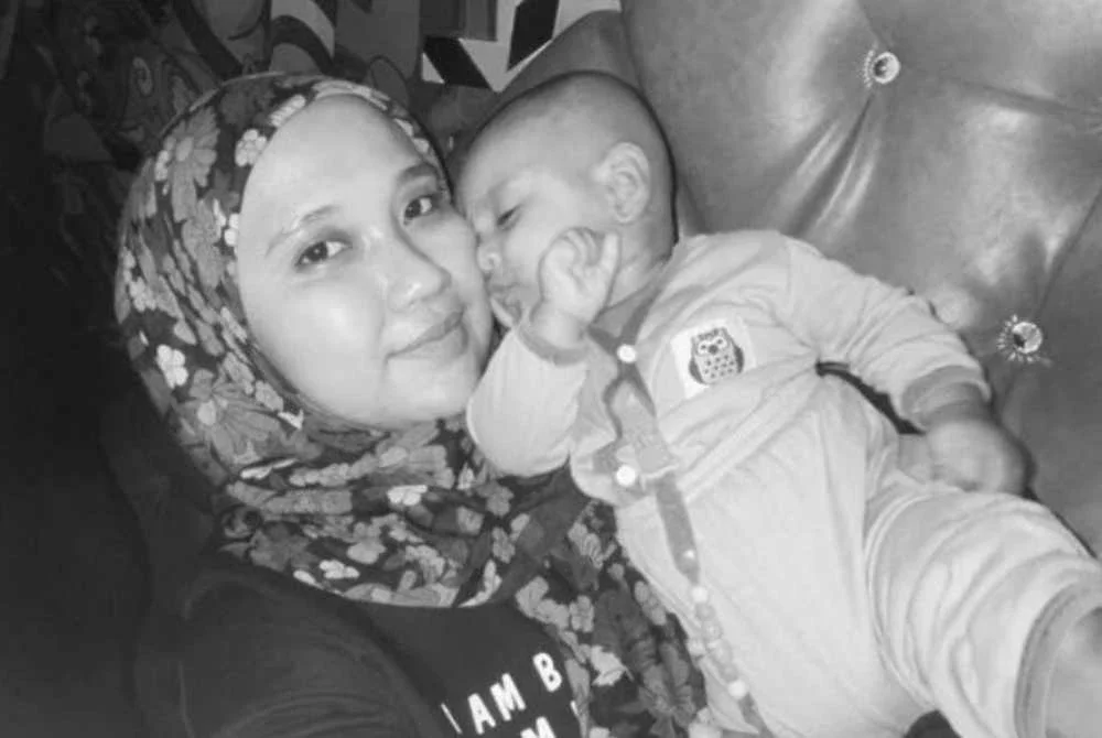 Nor Balqis bersama anaknya Mohd Iqbal maut dalam nahas di Jalan Sungai Rengit-Kota Tinggi pada Selasa.