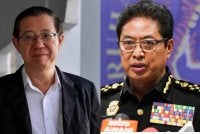 Guan Eng (kiri) dan Azam Baki.