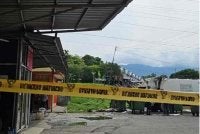 Lokasi mayat mangsa ditemukan dalam keadaan anggota badan dikerat sebelum dibuang di kawasan pembuangan sampah di Taman Indah Permai.