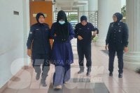 Nur Aini mengaku berkelakuan tidak sopan di Balai Polis Sungai Kob ketika dihadapkan ke Mahkamah Majistret Kulim.