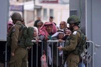 Penduduk Palestin menunggu kebenaran di pos pemeriksaan Israel selepas peraturan lebih ketat dilaksanakan sepanjang bulan Ramadan.
