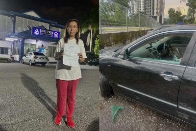 Teresa membuat laporan di Balai Polis TTDI selepas cermin kereta dipecah di Taman Persekutuan Bukit Kiara pada Ahad.
