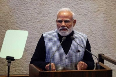 Narendra Modi ketika menyampaikan ucapan di Parlimen Israel.-AFP