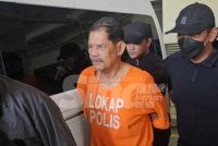Piluta Samad, 71, ketika dibawa ke Mahkamah Majistret Kota Kinabalu pada Jumaat. 