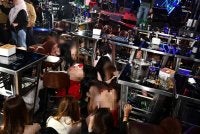 Antara wanita warga asing yang ditahan imigresen dalam serbuan Op Gegar di pusat hiburan di Kepong, Kuala Lumpur pada Jumaat. FOTO: Imigresen 