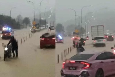 Tangkap layar video menunjukkan laluan empat lorong yang menghala ke Utara dan Selatan ditenggelami air.