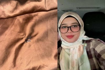 Kain Hazwani yang berlubang akibat terkena mercun ketika berbuka puasa di Jambatan Angkat.