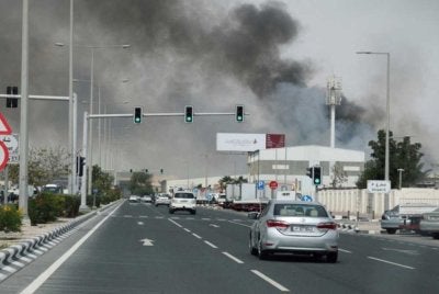 Asap berkepul selepas serangan peluru berpandu Iran, seperti yang dilihat dari Doha, Qatar. Foto Reuters