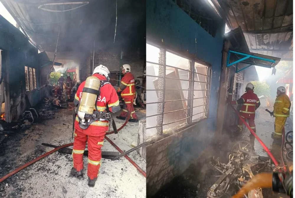 Anggota bomba sedang memadam kebakaran sebuah rumah berhampiran sebuah kedai nasi ayam berempah di Kampung Guar Kepayang pada petang Jumaat. Foto: Ihsan bomba