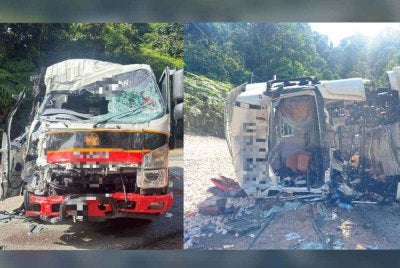 Kepala treler dipandu mangsa yang remuk selepas terbalik dan bertembung dengan lori. Foto: PDRM