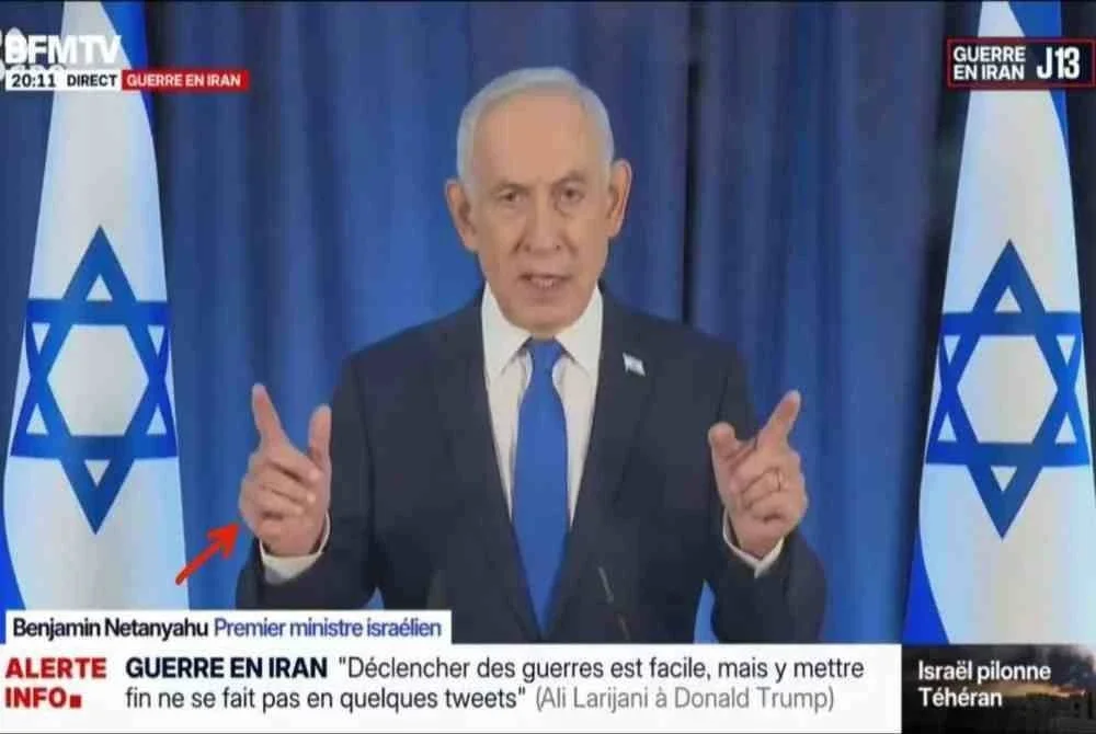Tangkapan layar video tersebut yang memaparkan jari tambahan keenam pada tangan kanan Netanyahu. - Foto: Agensi