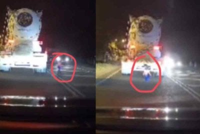 Tangkap layar video tular memaparkan seorang kanak-kanak berlari ke tengah jalan raya pada waktu malam di Jalan Terachi, Kuala Pilah