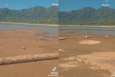 Paras air menyusut di Tasik Pedu hingga menampakkan kawasan daratan dan kubur lama.
