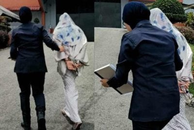 Pihak polis membawa Nurul Syafiqaa (kanan) ke Penjara Kajang selepas gagal membayar denda pada Selasa.