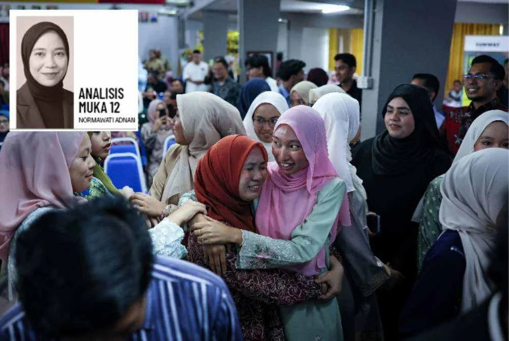 Reaksi pelajar yang tidak dapat menahan sebak selepas memperoleh keputusan cemerlang dalam SPM 2025 semasa Majlis Pengumuman Keputusan Peperiksaan SPM 2025 Peringkat Negeri Perak di Sekolah Menengah Kebangsaan Raja Permaisuri Bainun pada Selasa. Foto Bernama