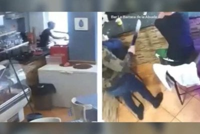 Rakaman sistem kamera litar tertutup (CCTV) menunjukkan kakitangan bar tersebut tidak mengendahkan ancaman perompak tersebut yang disangka 'prank'. - Foto Agensi