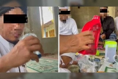 Rakaman yang tular menunjukkan mereka bergilir-gilir meminum minyak enjin. Foto Agensi