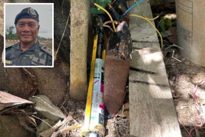 Lokasi bom-bom ikan yang ditemui di pangkal pokok kelapa sawit. Gambar kecil: Ahmad Radzi 
