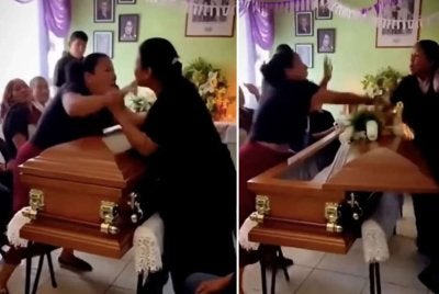 Tangkap layar dua wanita bergaduh di hadapan keranda seorang lelaki selepas tersedar rupa-rupanya 'dimadukan'. Foto Jam Press/The Sun UK.
