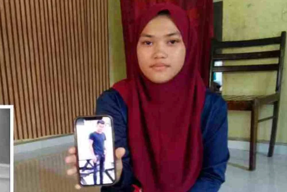 Nur Aina menunjukkan gambar abangnya, Allahyarham Muhammad Zakir. Foto: Nur Aina