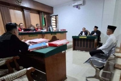 Tertuduh semasa proses perbicaraan di mahkamah. - Agensi