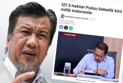 Laporan Sinar Harian dan Zulkarnain (kanan).