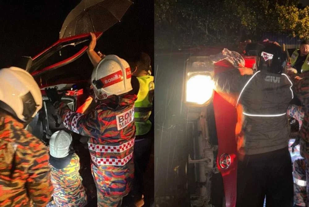 Anggota bomba menjalankan kerja penyelamatan di lokasi kejadian.