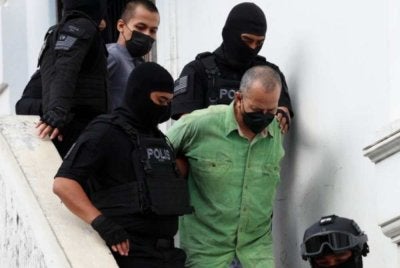 Radin Imran (depan), Radin Romyullah (belakang) dihadapkan ke mahkamah atas pertuduhan berkaitan keganasan. Gambar fail Bernama