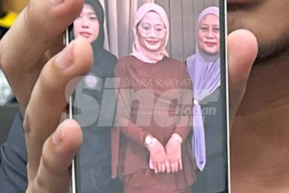 Nurfisya Zulkifly, 19, (tengah) disahkan polis sebagai penuntut sebuah kolej. Foto Sinar Harian