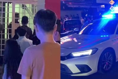 Tangkap layar video tular memaparkan seorang lelaki mengamuk di tangga kedai di Damansara Perdana pada Isnin.