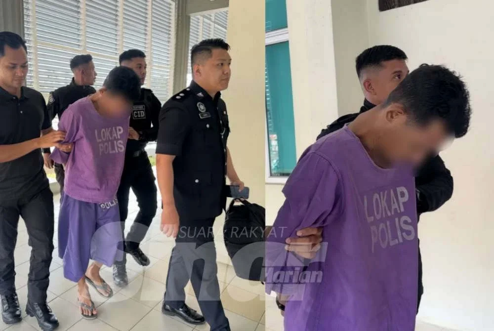 Tertuduh dikawal ketat polis ketika berjalan menuju ke lokap mahkamah. FOTO - ADILA SHARINNI WAHID