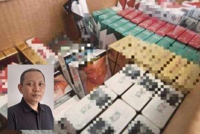 Warga asing kini menjadi sebahagian daripada jentera pengedaran rokok seludup di negara kita. Gambar kecil: Zaki Salleh
