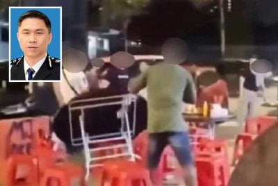 Gambar tular memaparkan seorang lelaki warga Nigeria merosakkan meja sebuah restoran di sini pada Isnin. Gambar kecil: Chan Hook