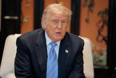 Trump bercakap semasa pertemuan dengan Presiden China, Xi Jinping di Taman Zhongnanhai, Beijing pada 15 Mei 2026. Foto AFP
