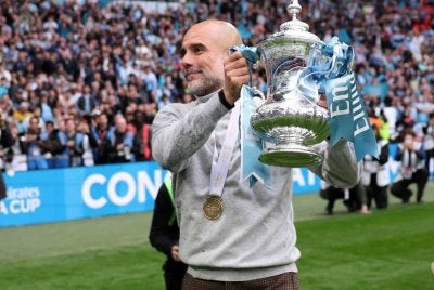 Guardiola membawa City meraih trofi kedua musim ini selepas pasukannya menundukkan Chelsea 1-0 pada final Piala FA di Wembley. - FOTO: Agensi