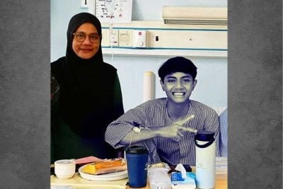Faris Zhafri ketika berada di wad untuk menjalani rawatan. - Foto FB AZuan Asmuni