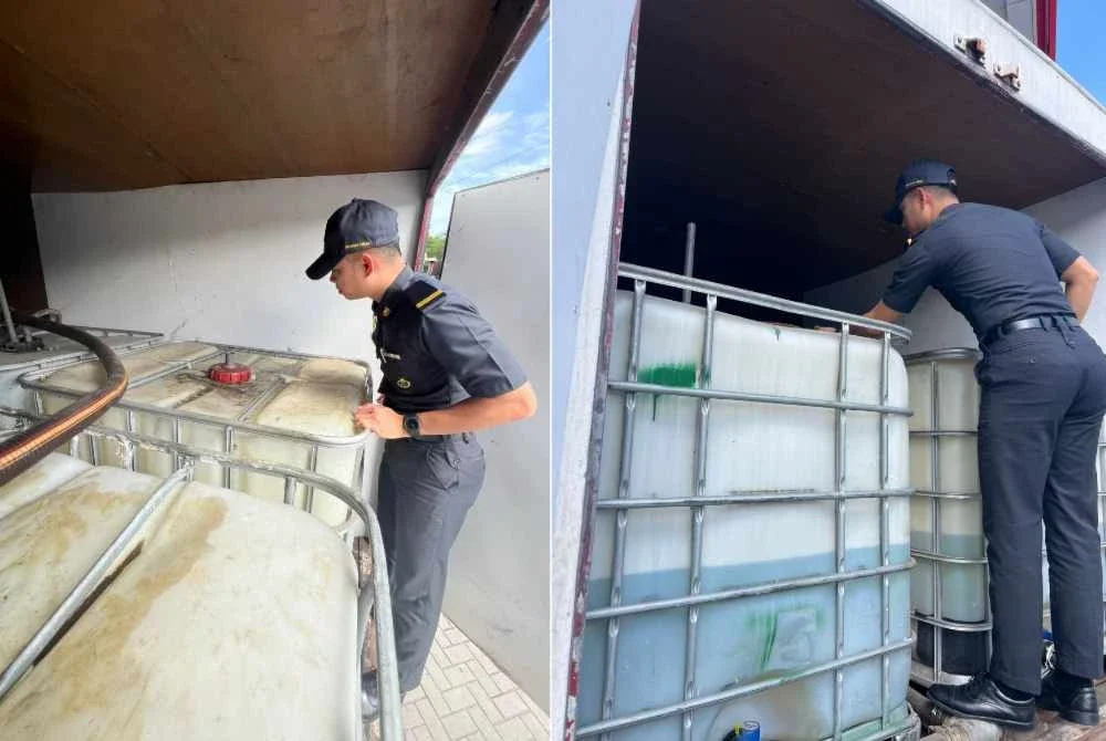 Anggota penguat kuasa KPDN sedang melakukan pemeriksaan ke atas sebuah lori yang membawa muatan IBC berisi bahan api disyaki diesel di Shah Alam pada Selasa.