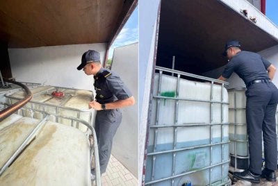 Anggota penguat kuasa KPDN sedang melakukan pemeriksaan ke atas sebuah lori yang membawa muatan IBC berisi bahan api disyaki diesel di Shah Alam pada Selasa. 